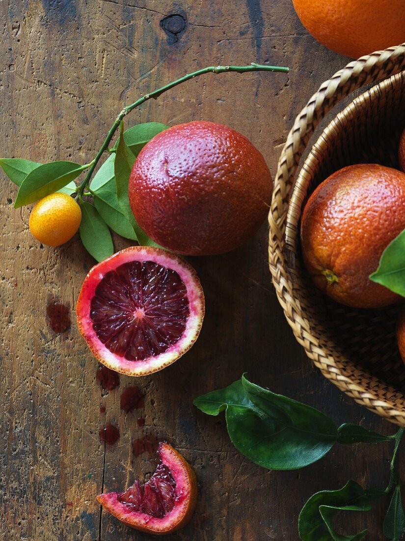 Blood oranges on a rustic wood table