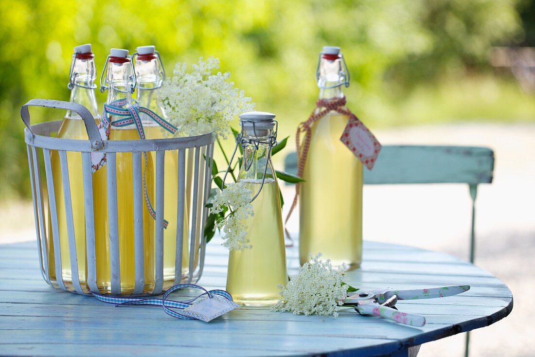Elderflower syrup on a garden table