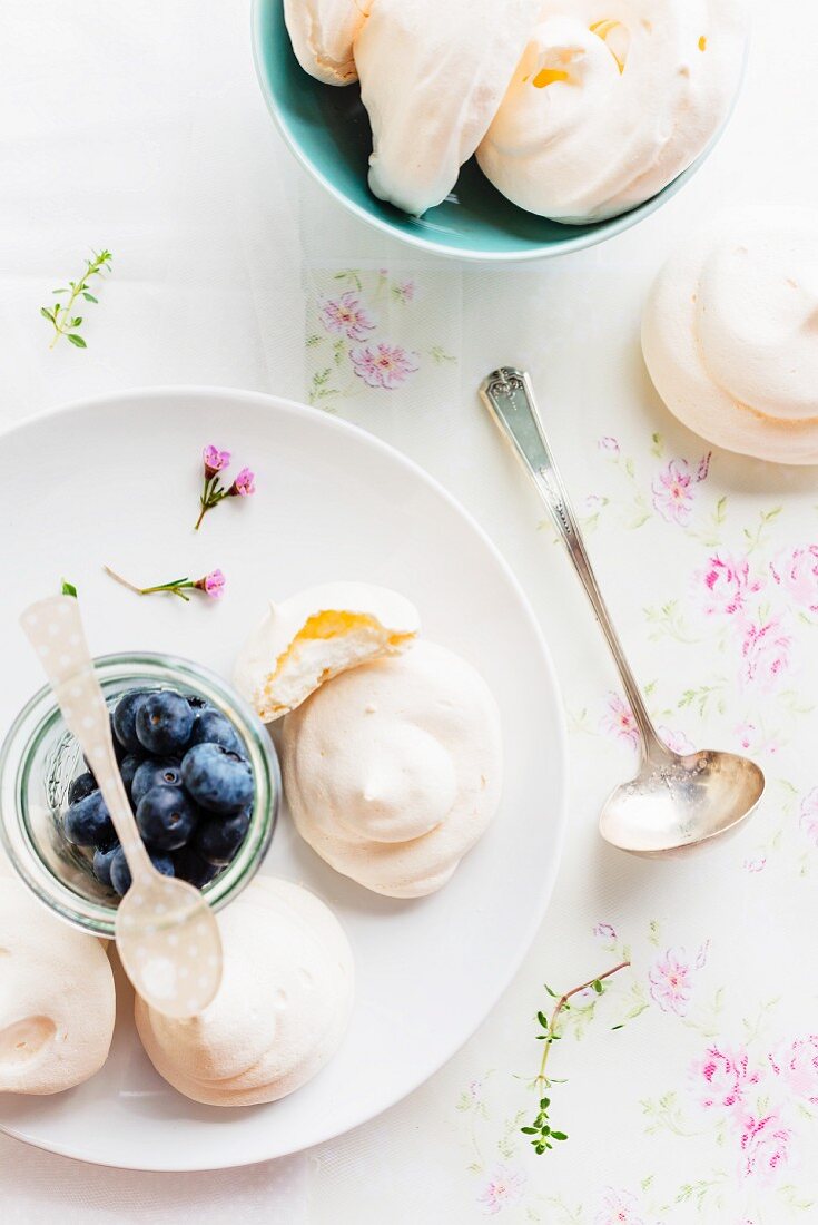 Delicate rosewater pavlovas with fresh blueberries