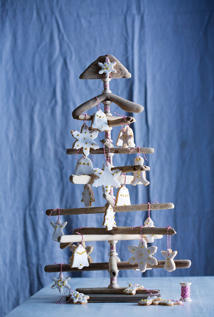 Iced biscuits decorating wooden Christmas tree