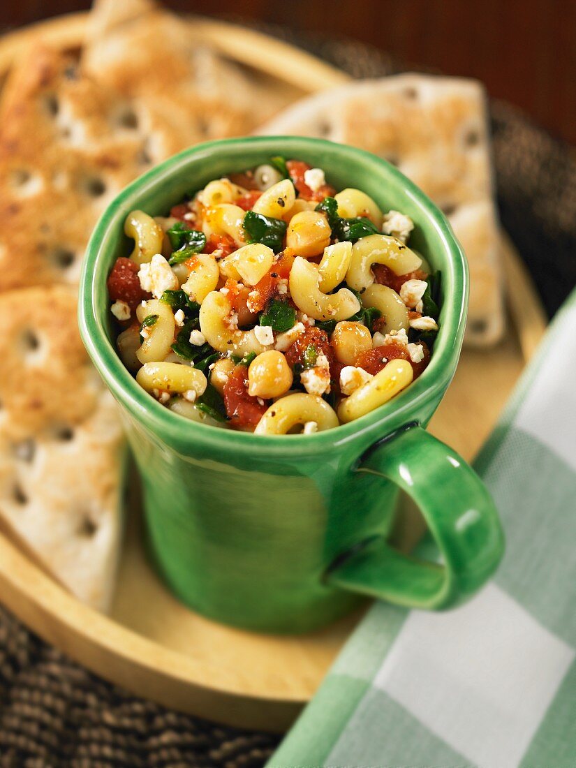 Elbow macaroni with spinach, feta and chickpeas served with focaccia