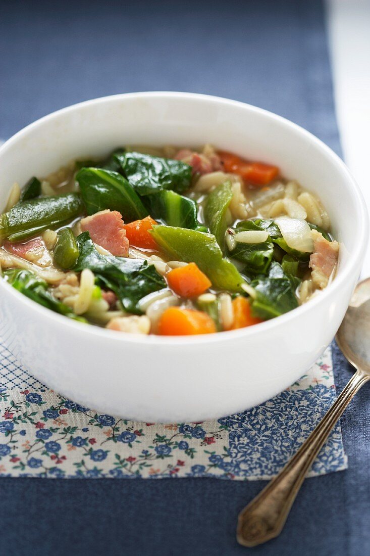 Vegetable soup with orzo pasta and bacon