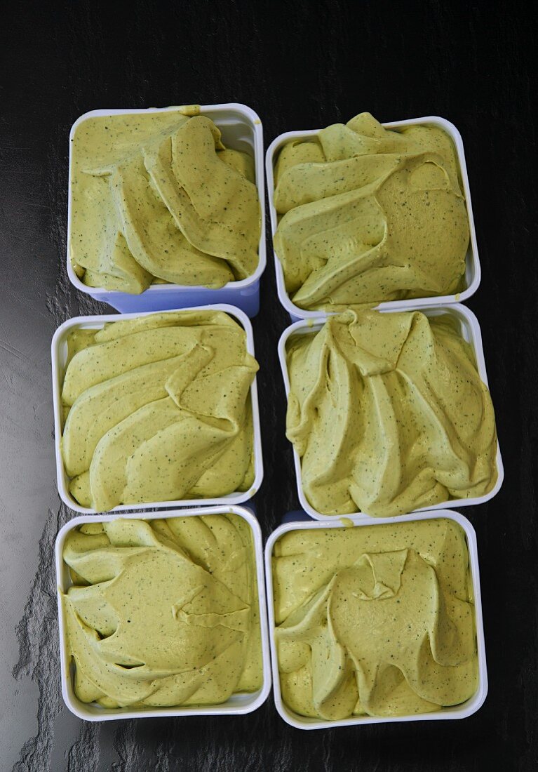 Six tubs on pistachio ice cream
