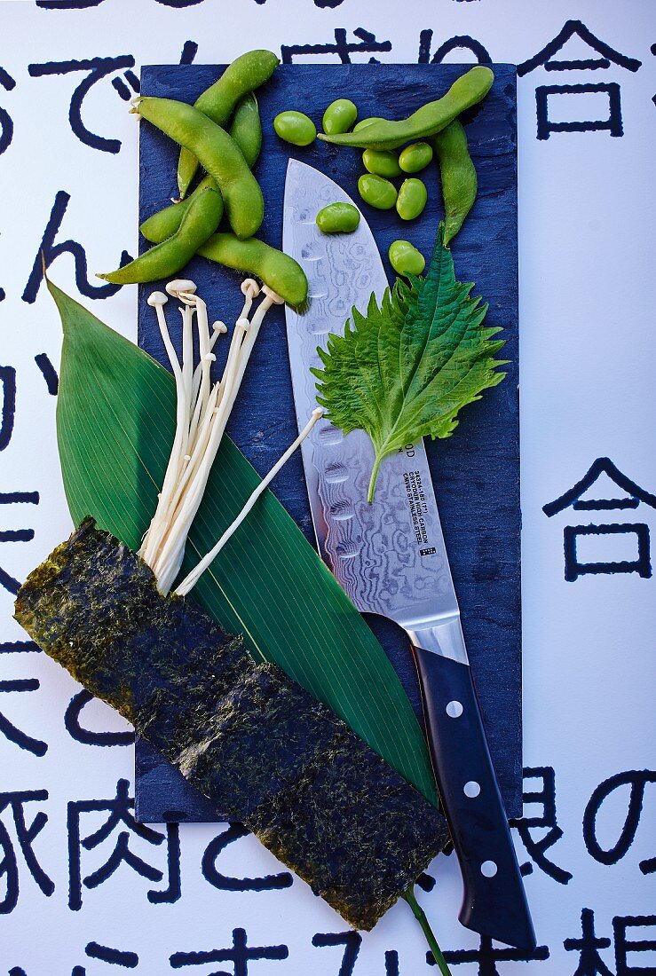 Vegetables, mushrooms, herbs and a knife from Japan