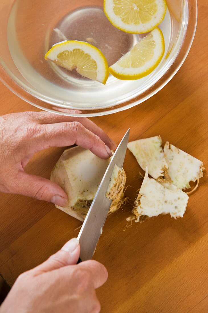 Celeriac being peeled