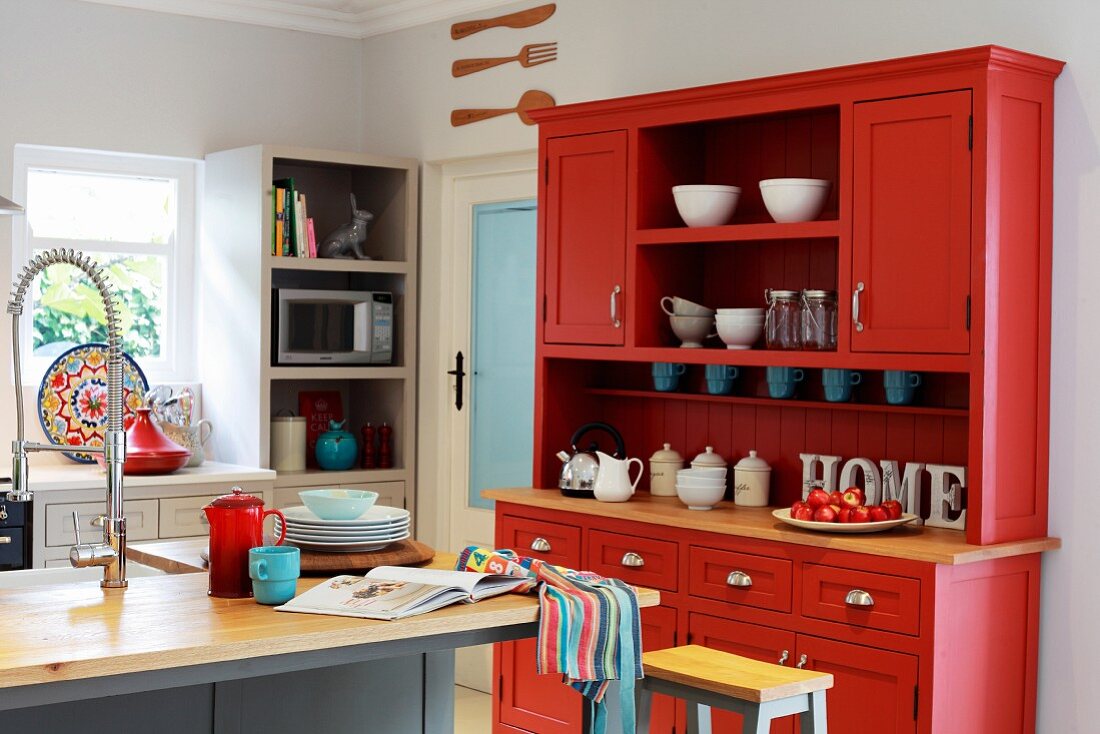 Red dresser in kitchen