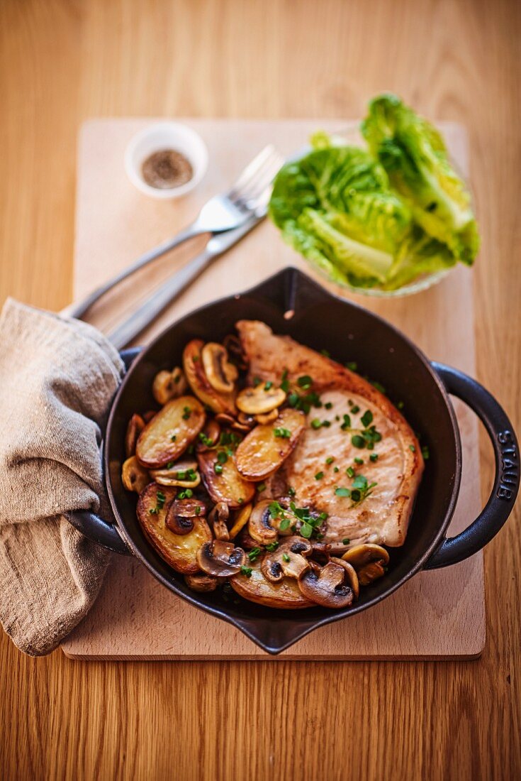 Pork chop with mushrooms and potatoes