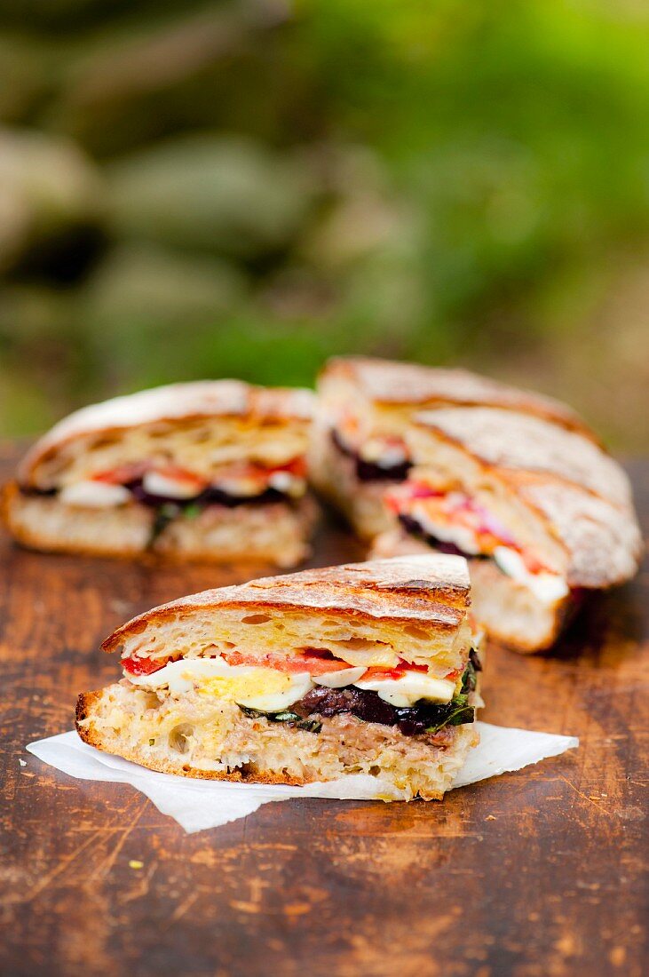 Pan bagnat (olive, egg, tomato and tuna sandwich, France)
