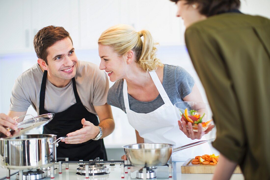 Friends cooking together in a kitchen