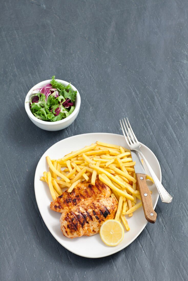 Grilled Barbecued Chicken with French Fries