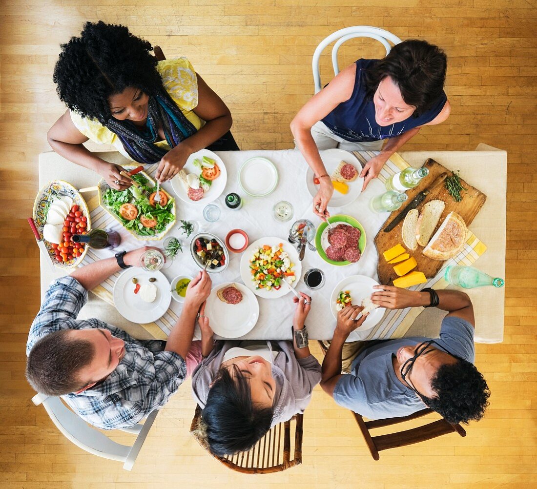 Friends eating together at a dinner party