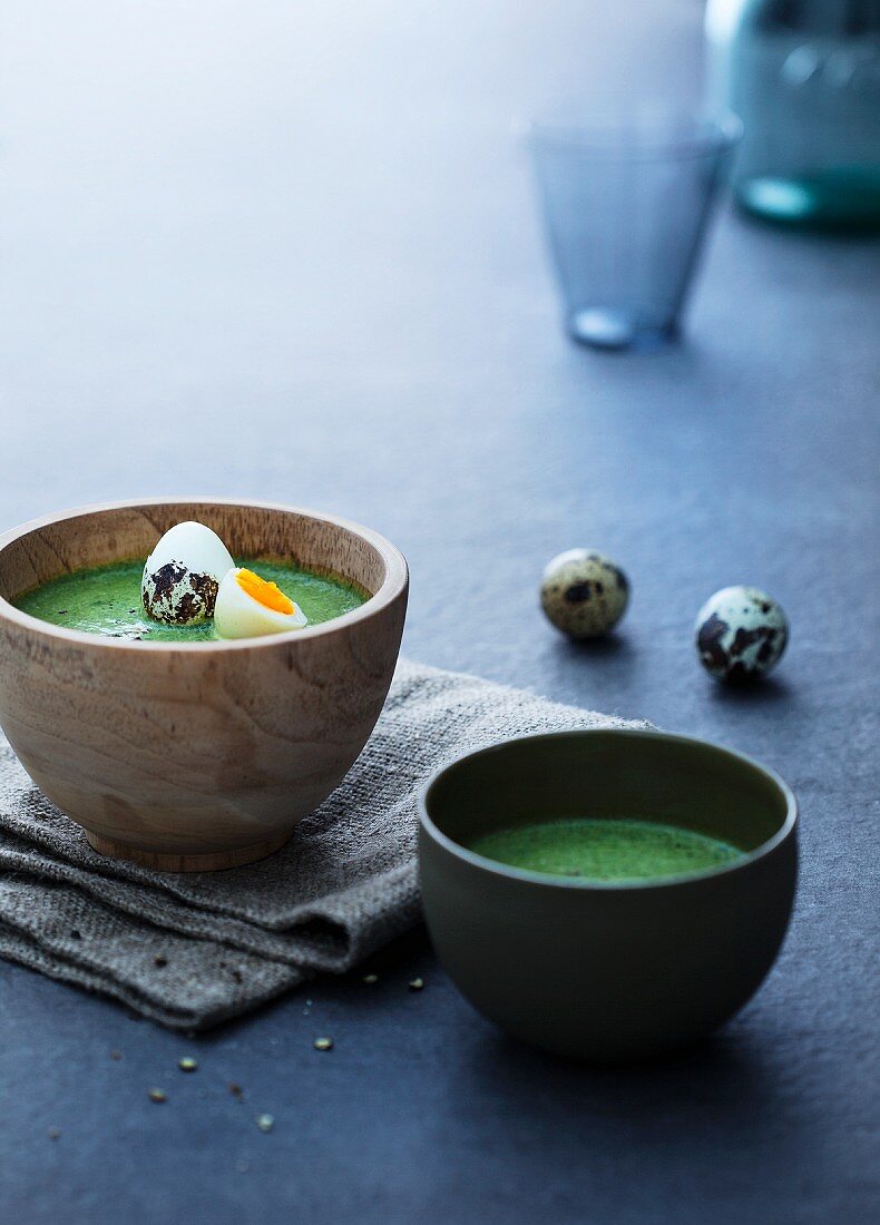 Spinach soup with quails eggs