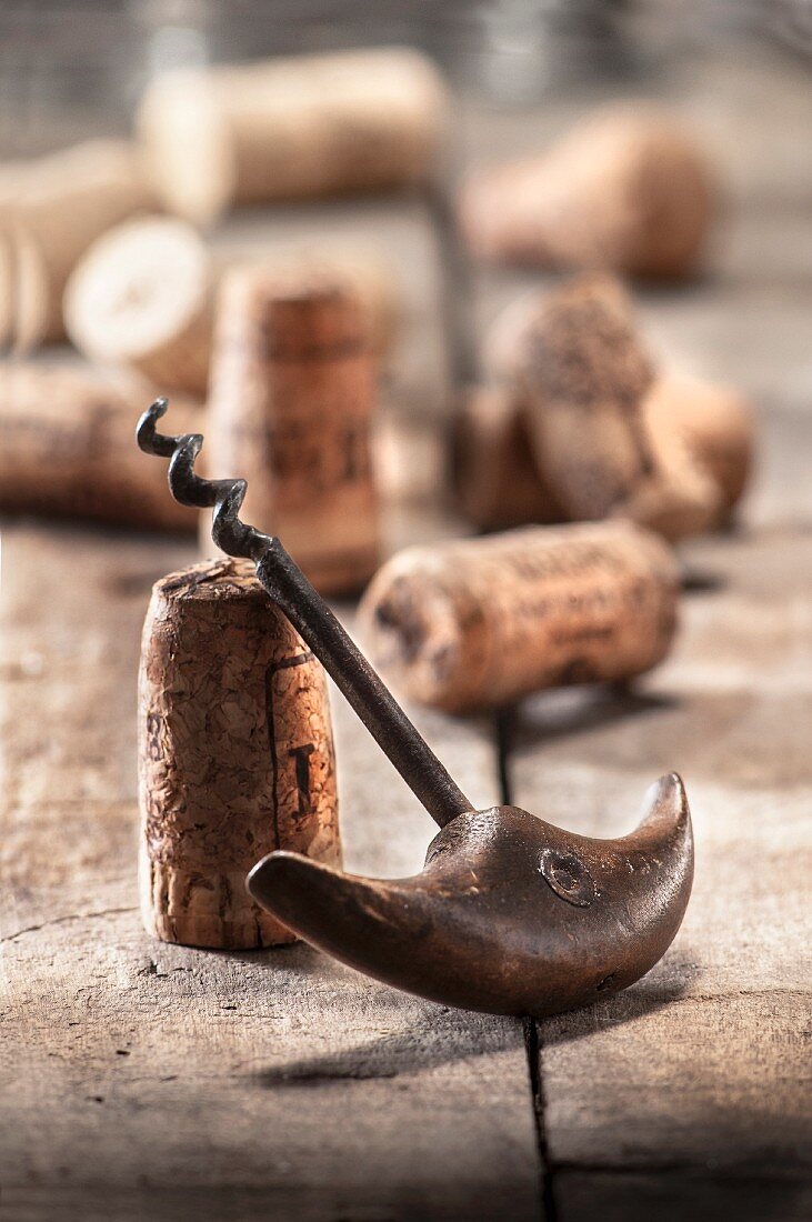 An old corkscrew and wine corks