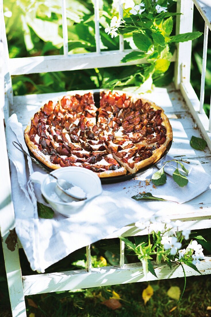 Damson tart with a vanilla topping