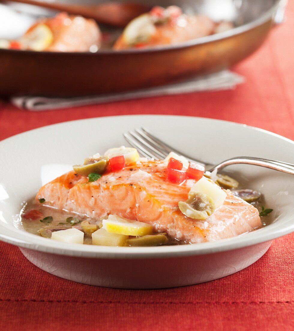 Marinated salmon with green olives, peppers and lemon