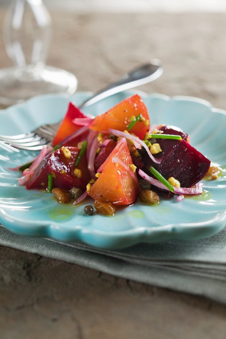 Beetroot and golden beet salad with raisins, red onions and pistachios