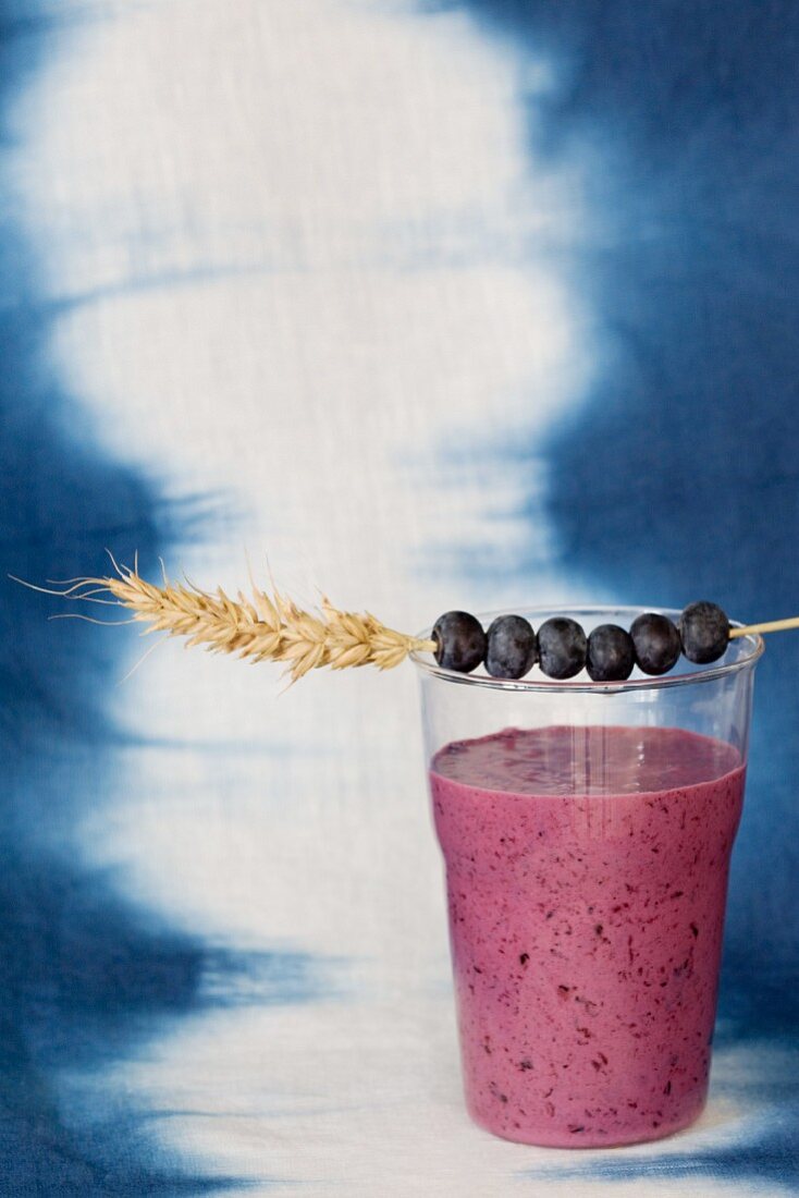 A blueberry smoothie with apple and banana