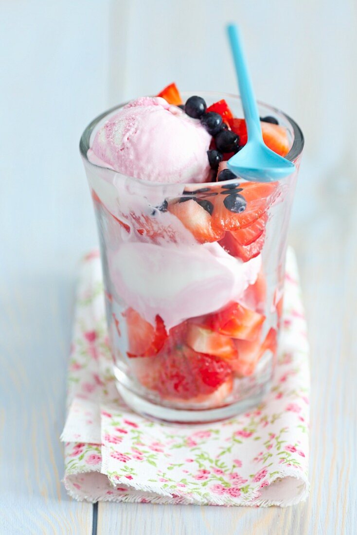 Strawberry ice cream with strawberries and blueberries