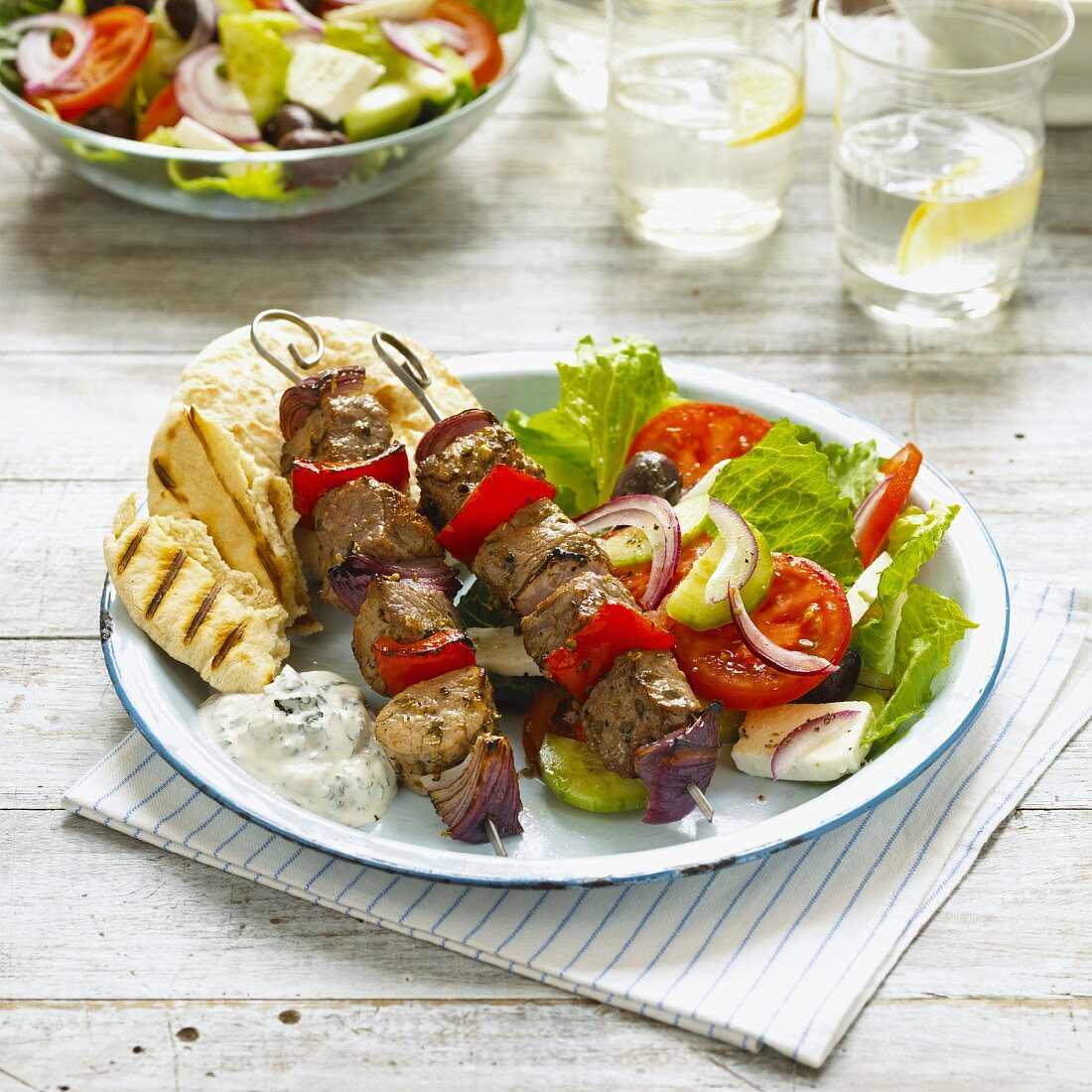 Lamb skewers with Greek salad
