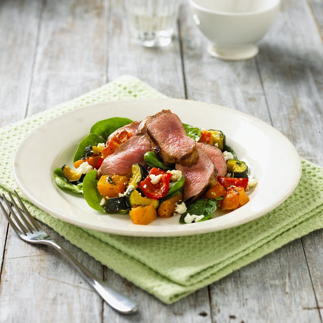 Roasted vegetable salad with lamb and feta cheese