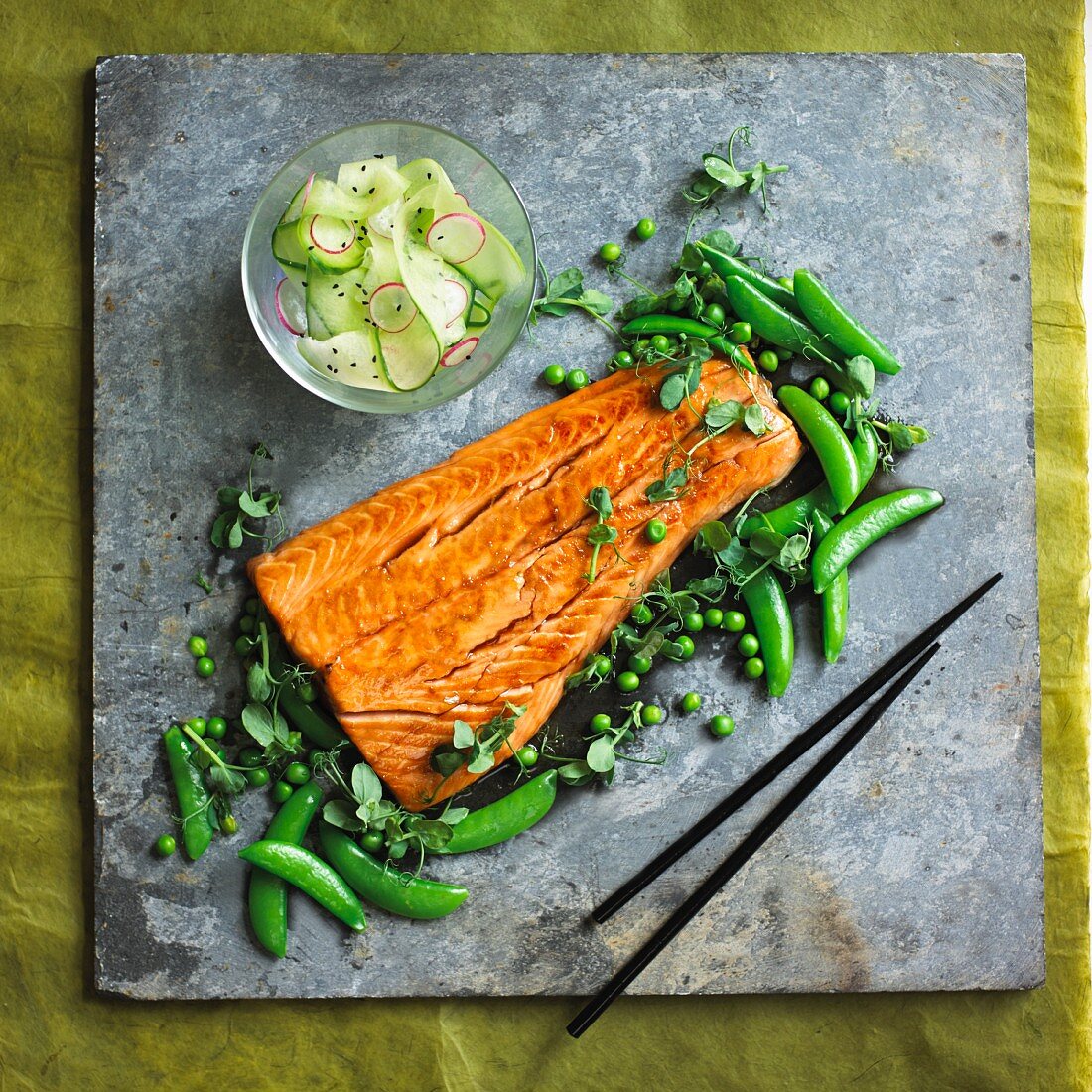 Salmon teriyaki with peas and cucumber salad