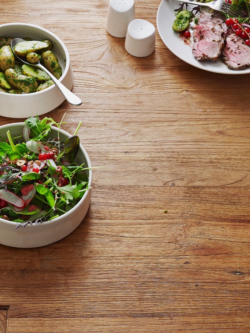 Salad, dill potatoes and roast lamb (Scandinavia)