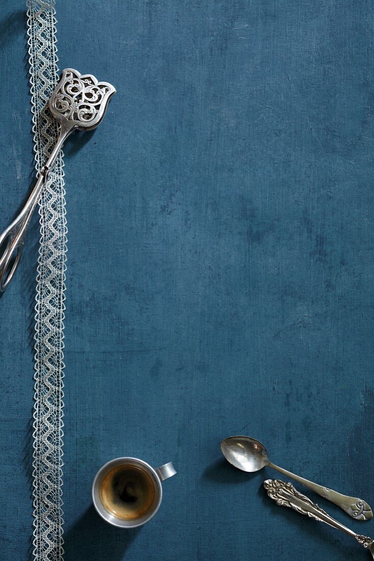 Cake tongs, a coffee spoon and espresso