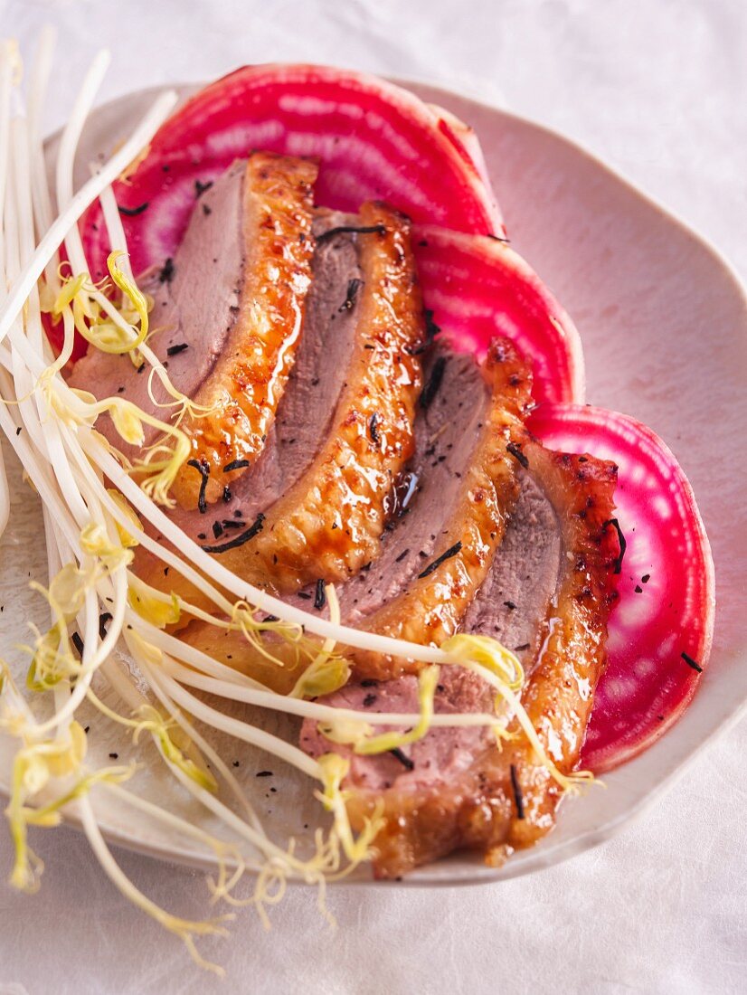 Duck breast with tea on chioggia beets