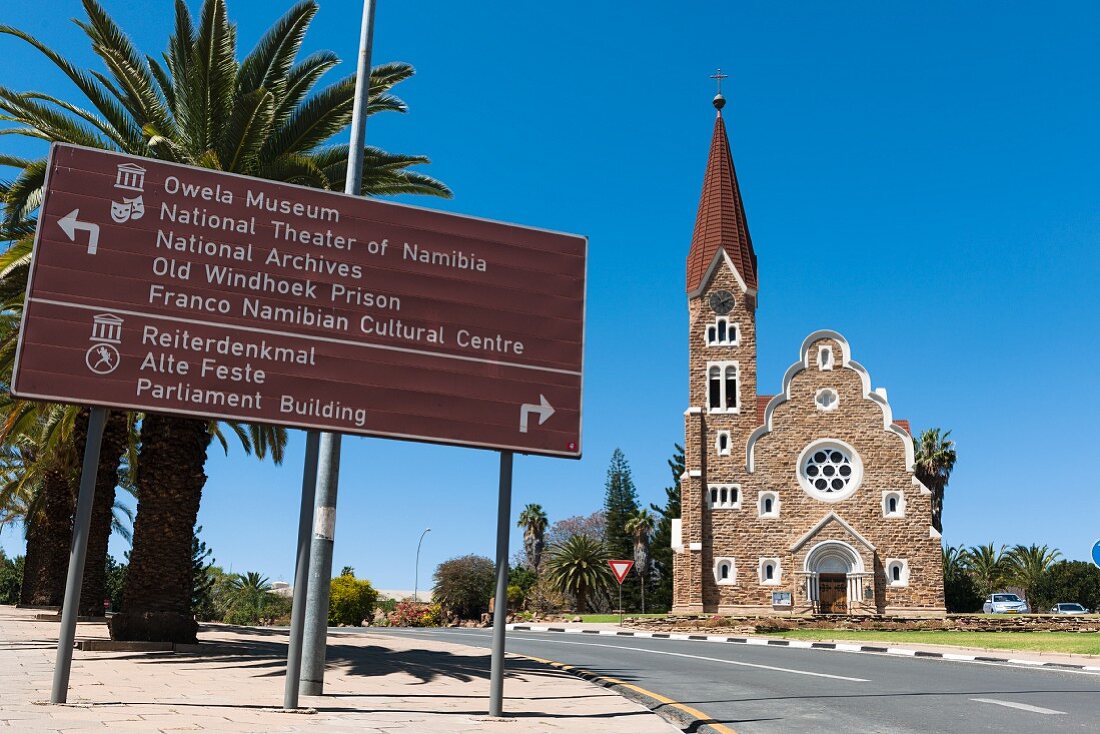 A signpost in front of Christuskirche in Windhoek, Namibia