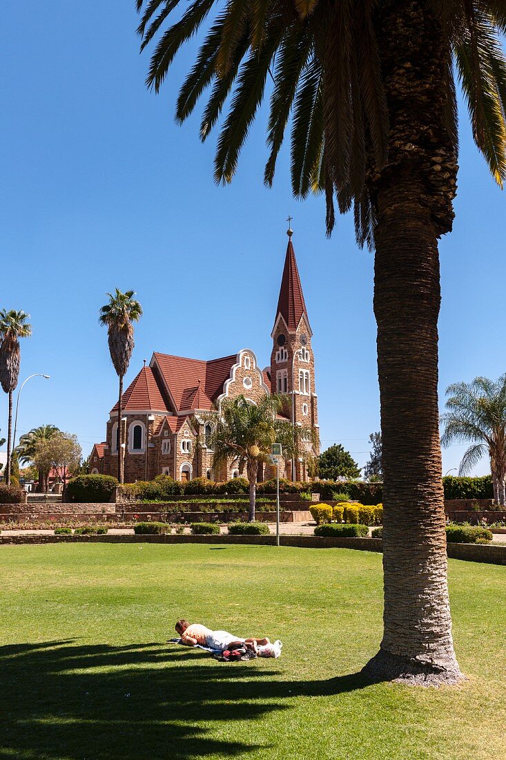 A view of a park looking towards Christuskirche in Windhoek, Namibia