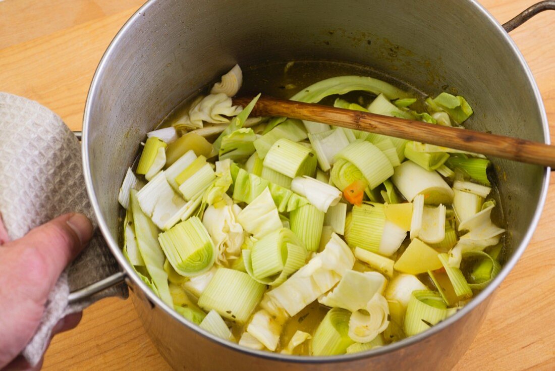 Sliced leek with stock in a saucepan