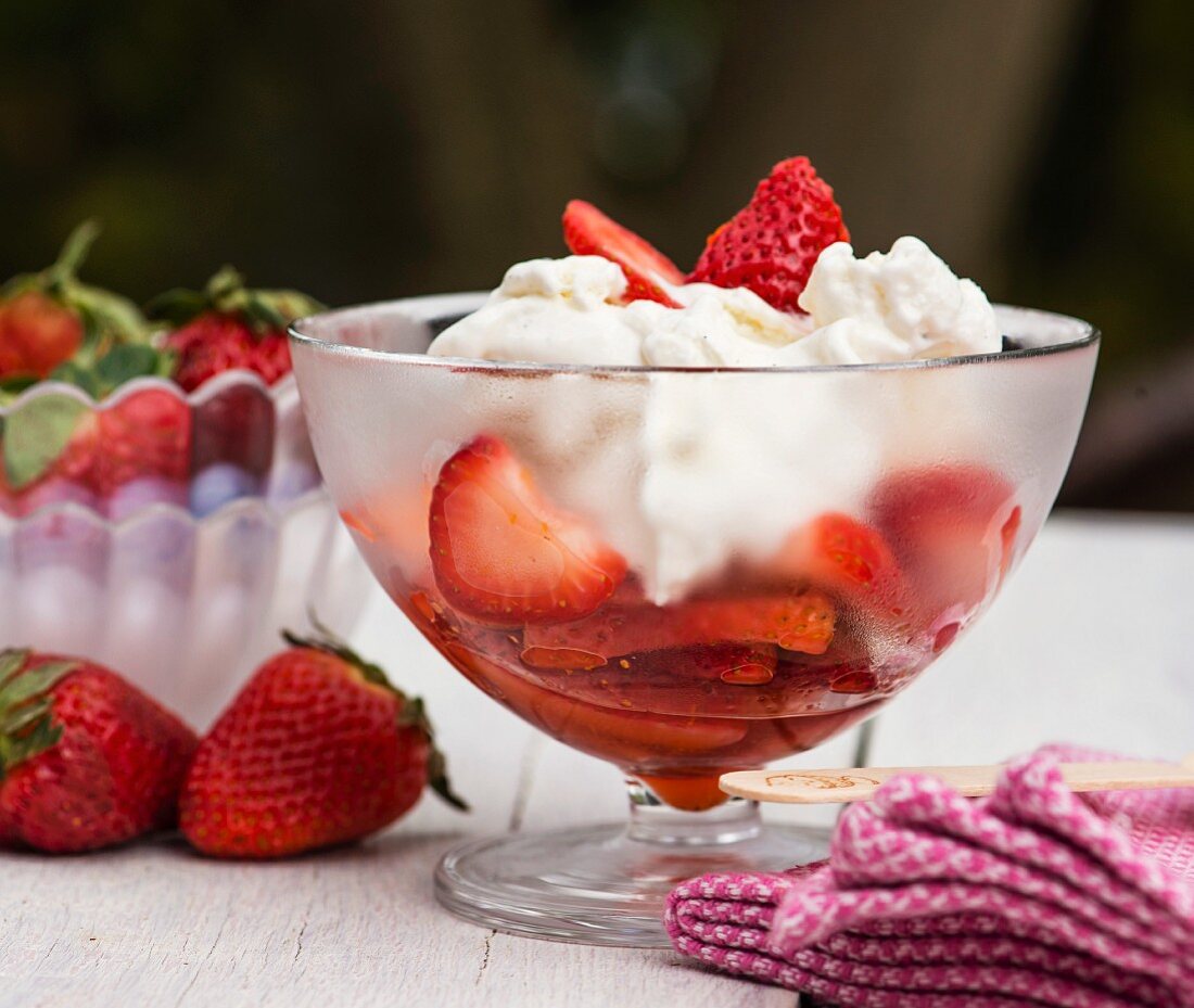 Fresh strawberries with vanilla ice cream