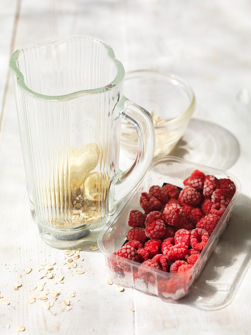 Ingredients for a raspberry and banana smoothie
