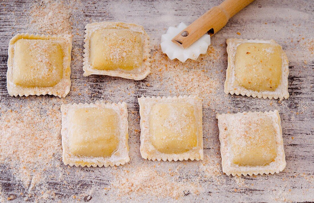 Homemade wholemeal ravioli with a pastry wheel
