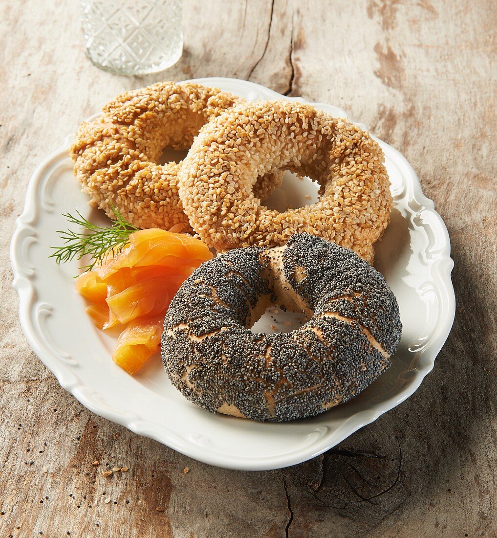 Three different bagels with smoked salmon and dill