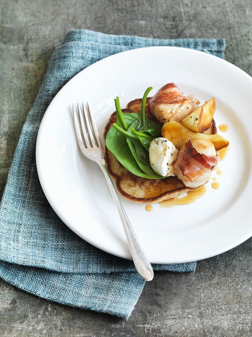 Buckwheat pancakes with apple and scallops wrapped in bacon