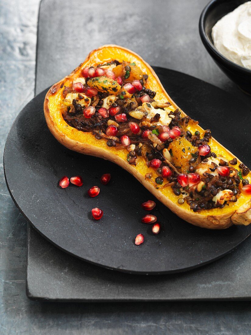 Stuffed, fried butternut squash with caramelised lentils, feta cheese and pomegranate seeds