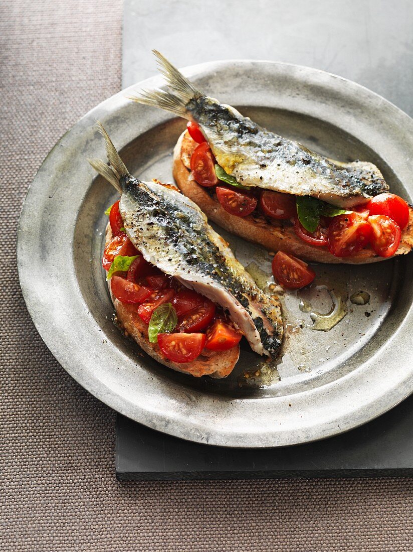 Toast topped with sardines and cherry tomatoes