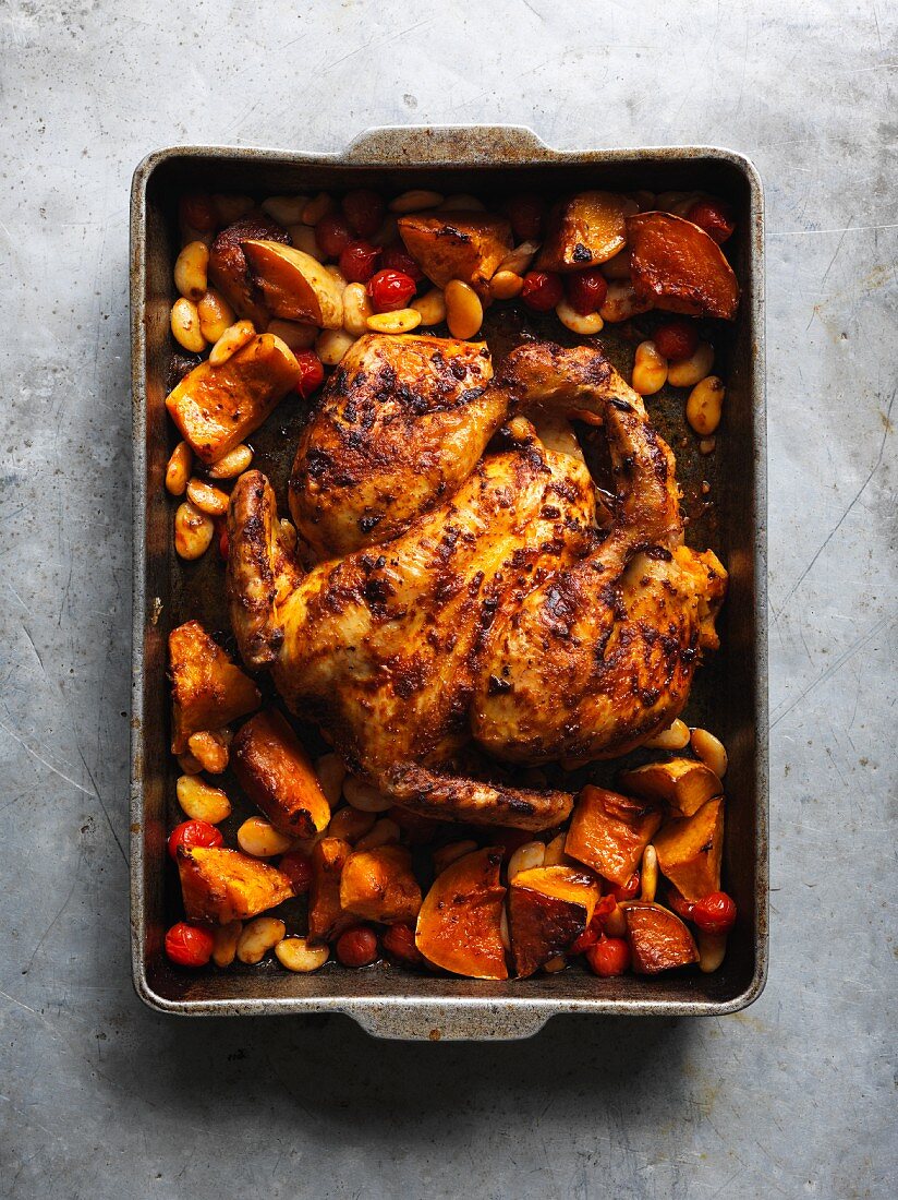 Slow-roasted pepper chicken with butternut squash, beans and tomatoes