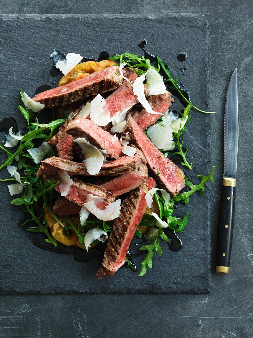 Tagliata Di Manzo with green tomatoes and rocket salad (Italy)