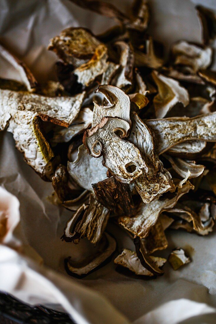 Dried porcini mushrooms on crumpled paper