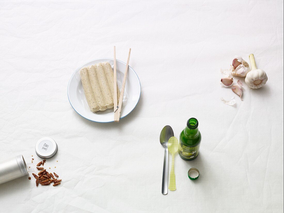 Ingredients for grilling: tofu sausage, garlic, chilli and lime juice