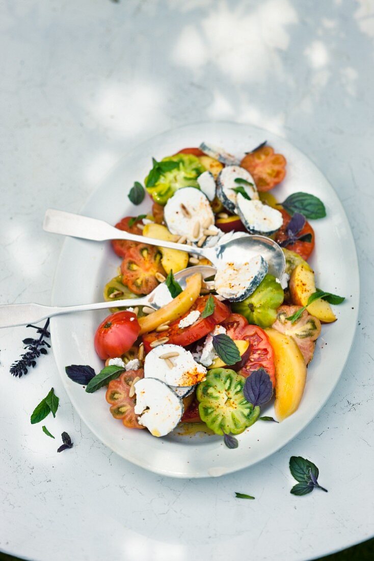 Fruity tomato salad with goat's cheese
