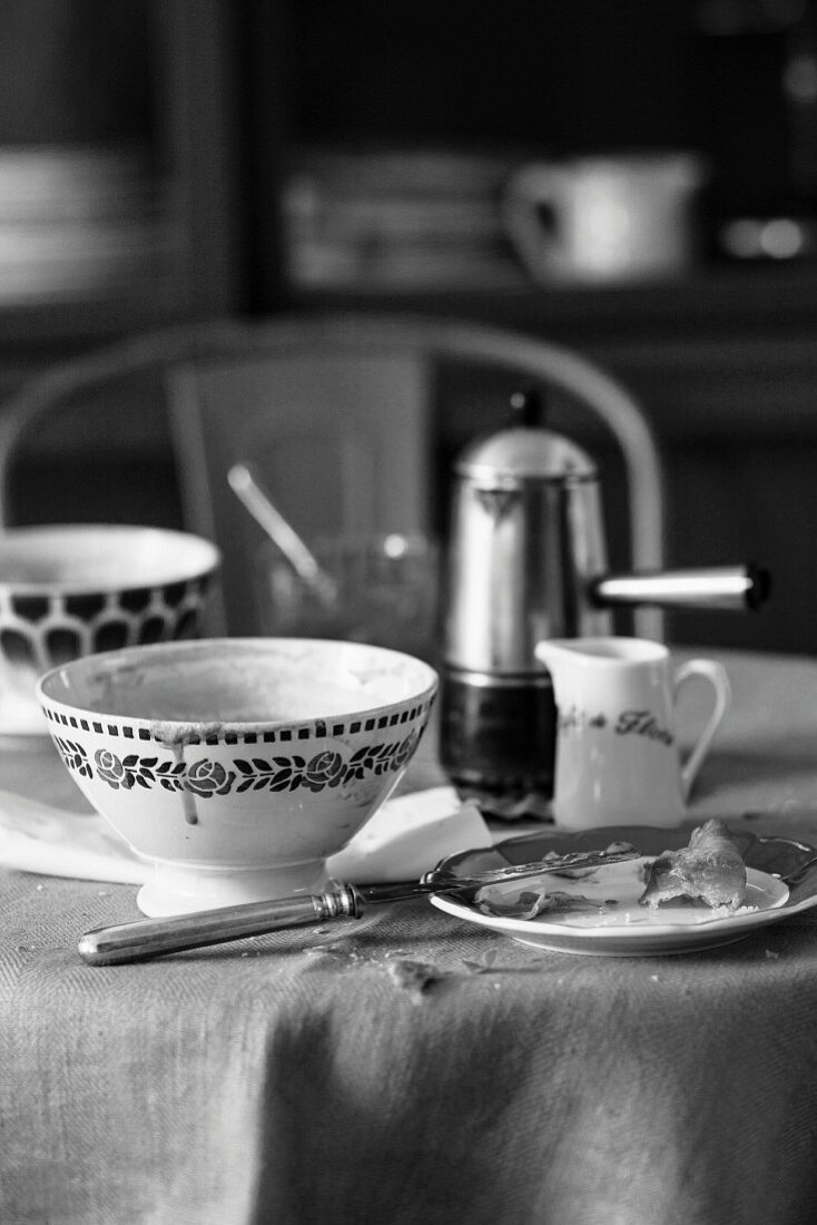 Used crockery on a breakfast table