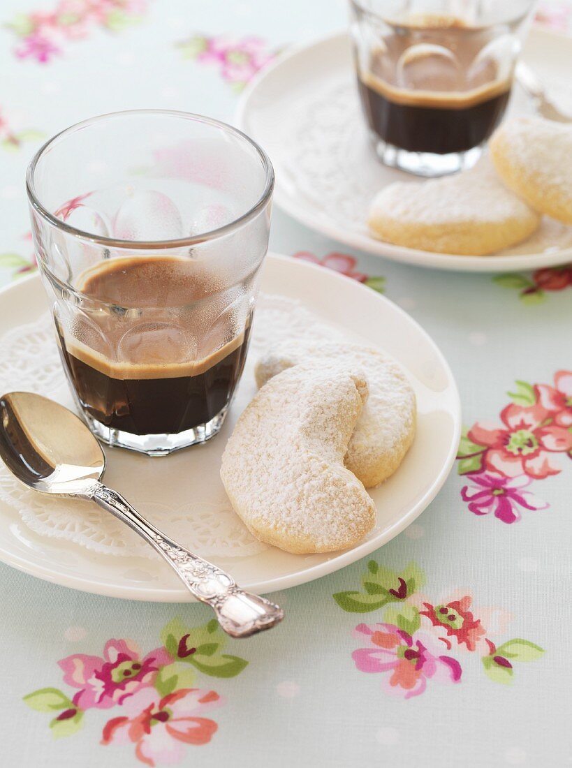 Almond crescent biscuits with black coffee
