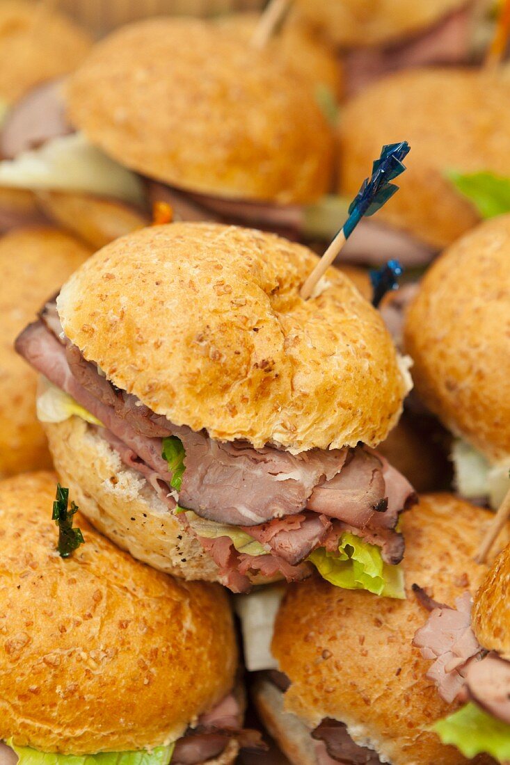 Roast beef sandwiches fastened with cocktail sticks