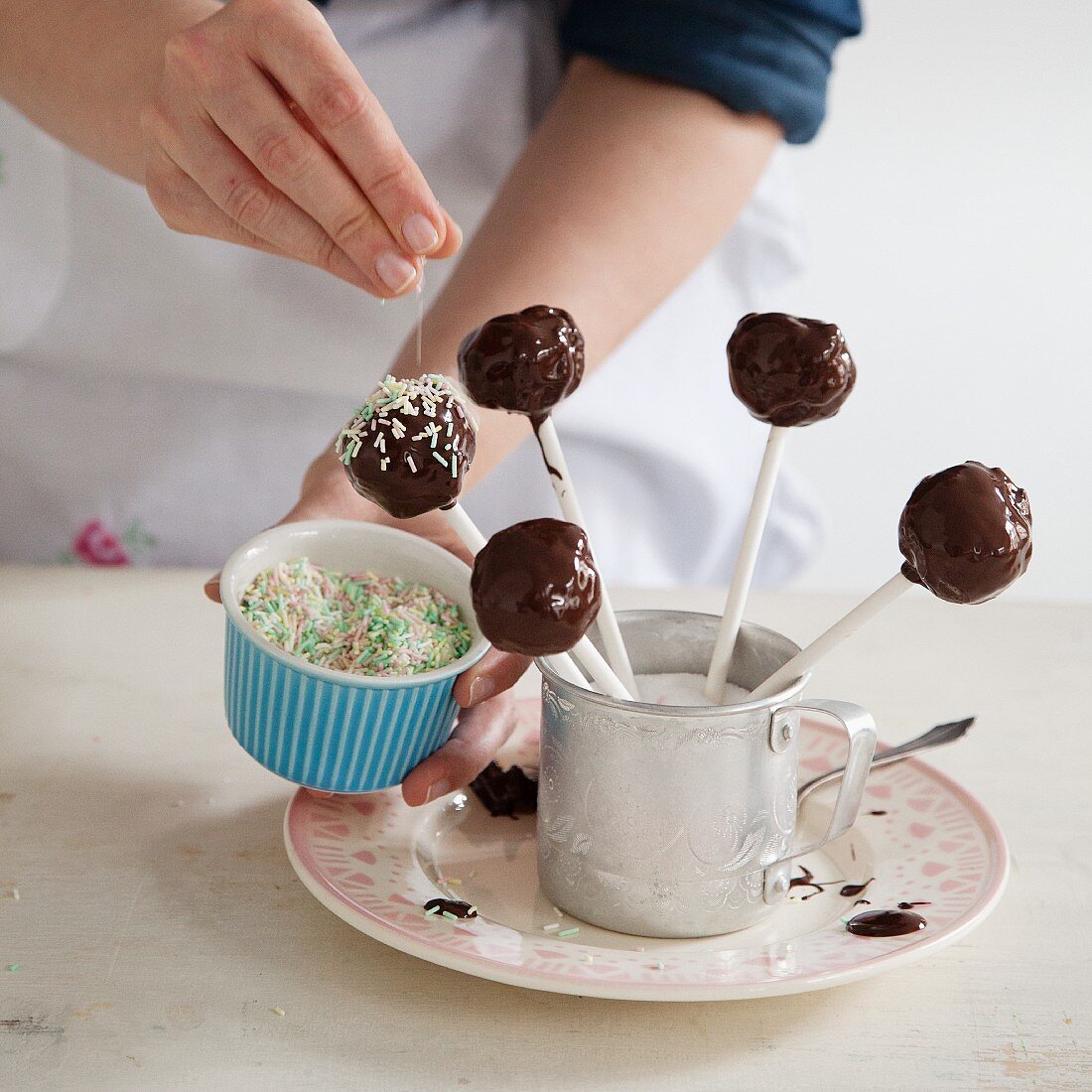 Vegan cake pops with carrots, chocolate glaze and sugar sprinkles