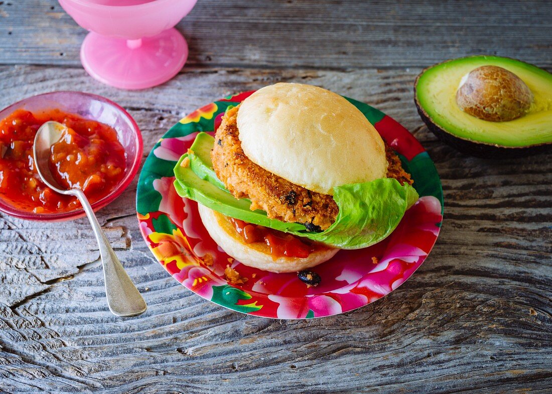 A vegan Mexican Burger: burger with tofu and salsa sauce