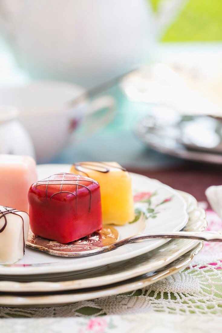 Various petit fours on a cake plate