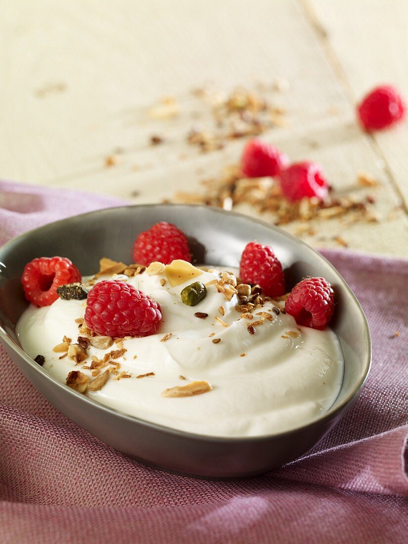 Yoghurt cream with nuts and raspberries